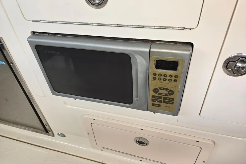 Bay'be Yacht Photos Pics Built-in microwave on 2009 Mainship Pilot 31 boat interior.