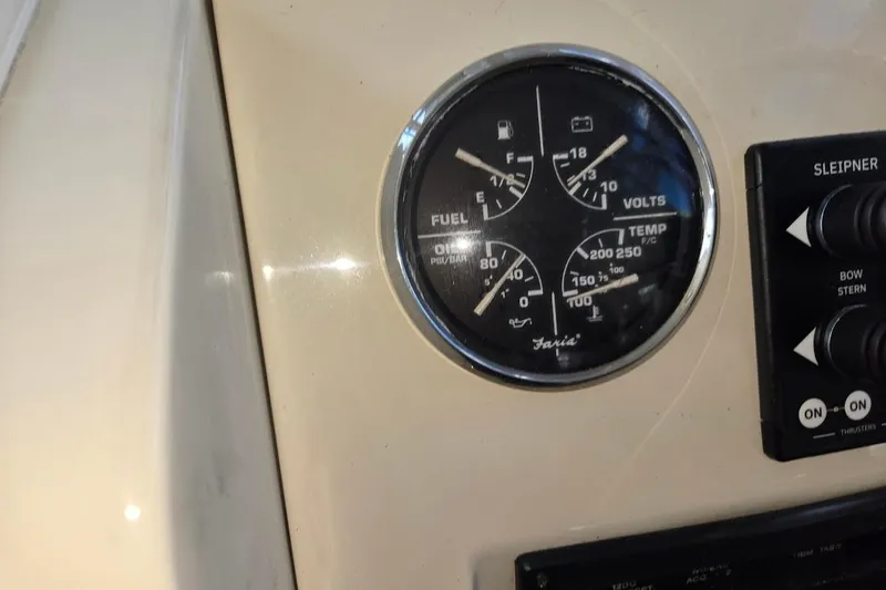 Bay'be Yacht Photos Pics Dashboard of a 2009 Mainship Pilot 31 with fuel and temperature gauges.