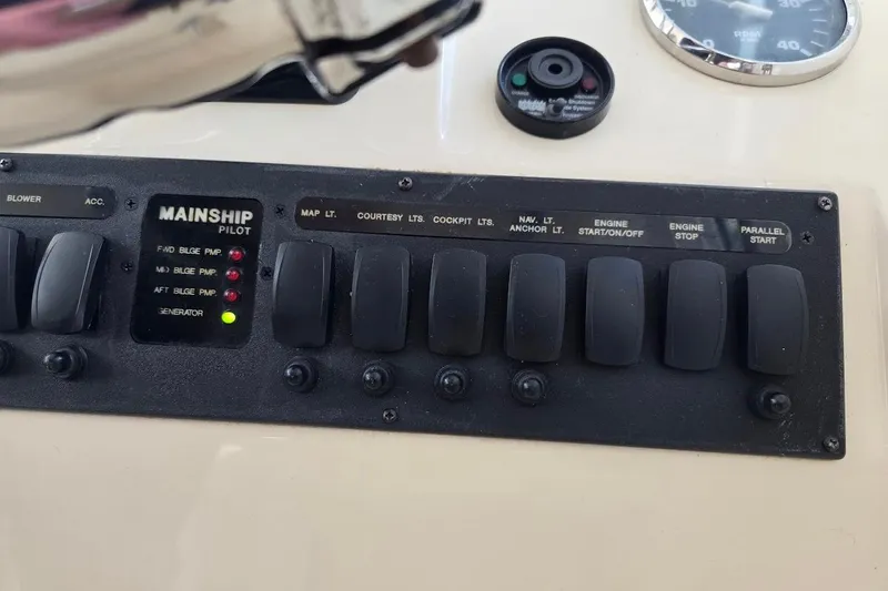 Bay'be Yacht Photos Pics Control panel of 2009 Mainship Pilot 31 boat with labeled switches and indicators.