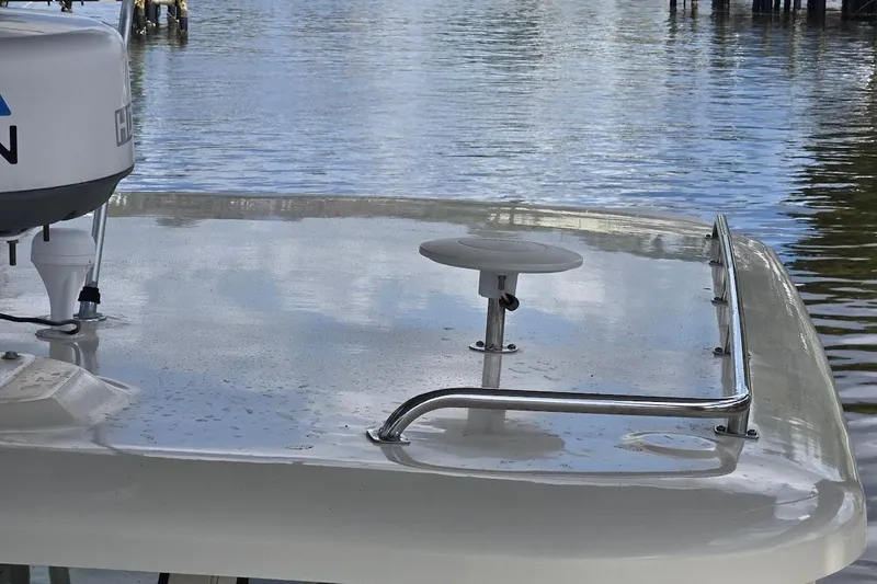 Bay'be Yacht Photos Pics 2009 Mainship Pilot 31 boat deck with radar, docked on calm water.