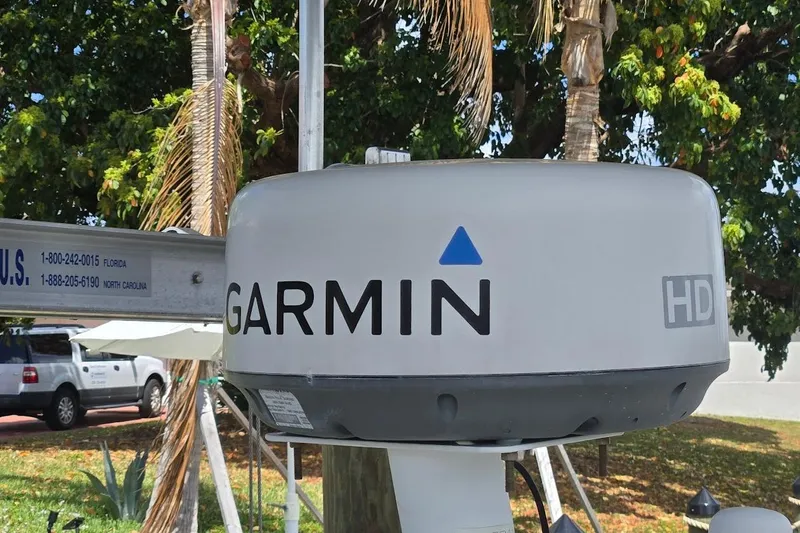 Bay'be Yacht Photos Pics Garmin HD radar on 2009 Mainship Pilot 31 boat, outdoor setting with trees.