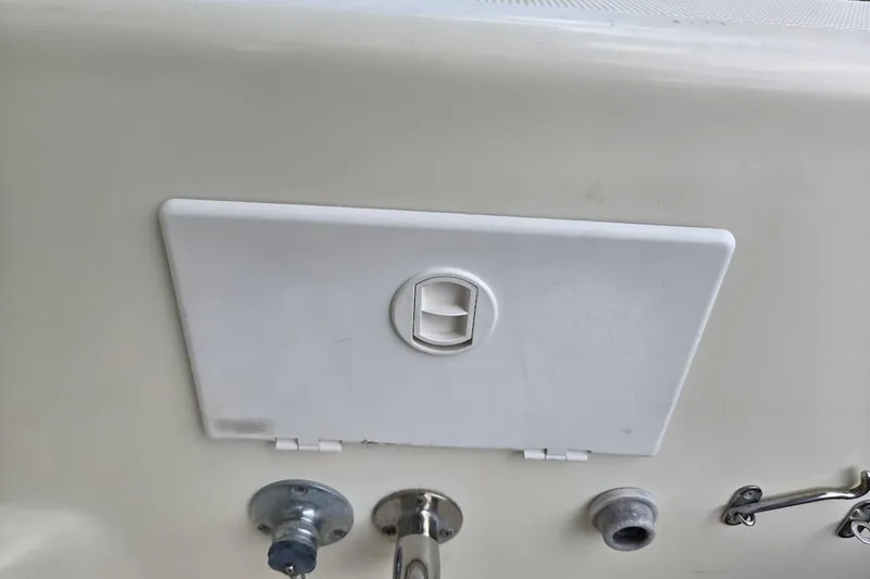 Bay'be Yacht Photos Pics Access panel on 2009 Mainship Pilot 31 boat, featuring latch and fittings.