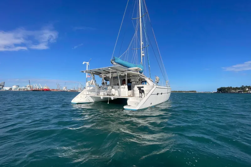Nadi Yacht Photos Pics Sailing catamaran Knysna 480, 2010 model, on open water with clear blue sky.