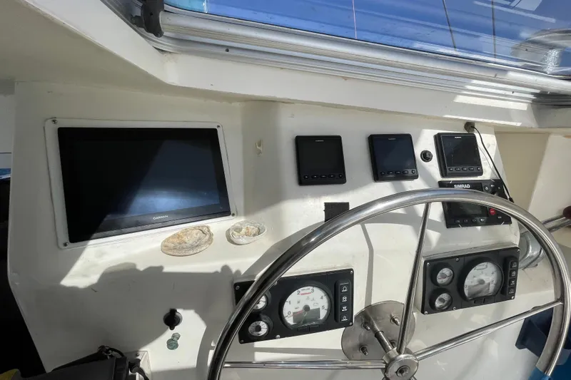 Nadi Yacht Photos Pics Helm of 2010 Knysna 480 yacht with navigation instruments and steering wheel.