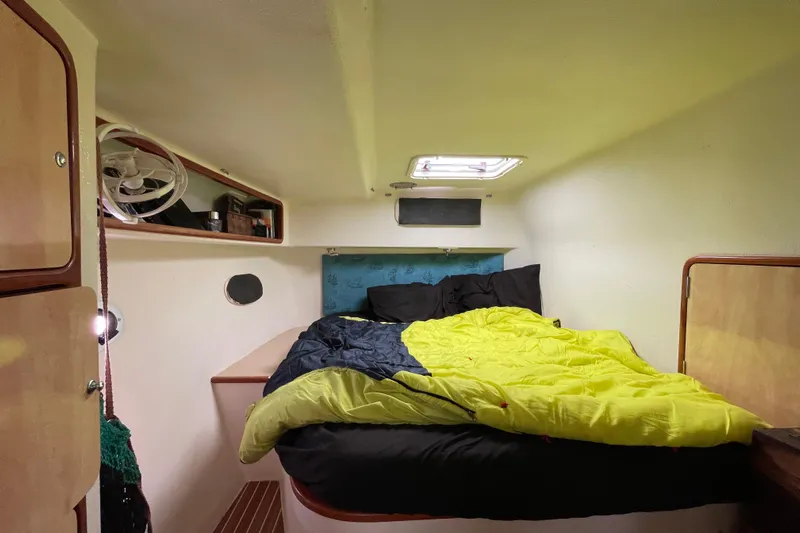 Nadi Yacht Photos Pics Cozy cabin interior of 2010 Knysna 480 yacht with bed and storage.