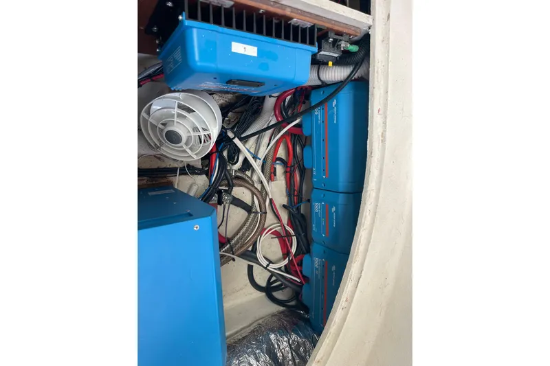 Nadi Yacht Photos Pics Electrical system setup in a 2010 Knysna 480 yacht, featuring blue inverters and wiring.