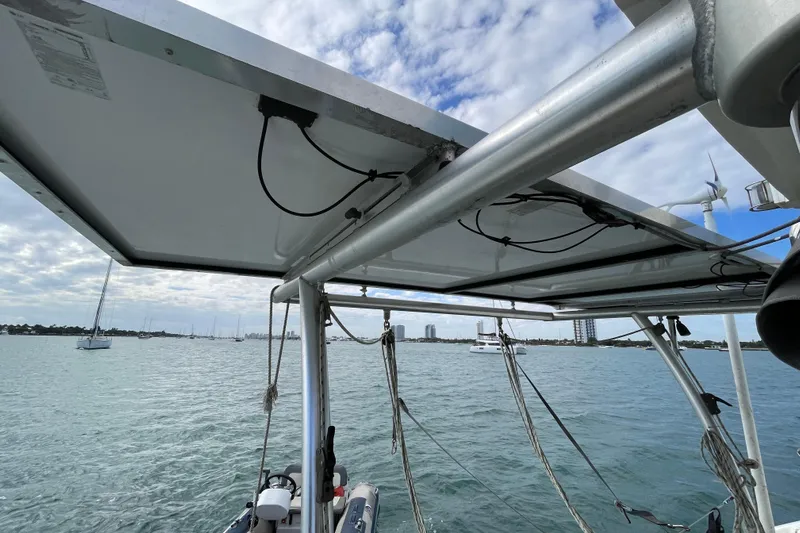 Nadi Yacht Photos Pics Solar panel setup on a 2010 Knysna 480 catamaran, overlooking a scenic harbor.