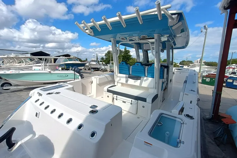 360-105 Yacht Photos Pics 2026 Robalo R360 Center Console boat with blue seating and spacious deck.
