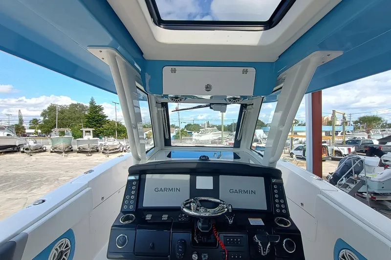 360-105 Yacht Photos Pics 2026 Robalo R360 Center Console boat interior with Garmin navigation system.