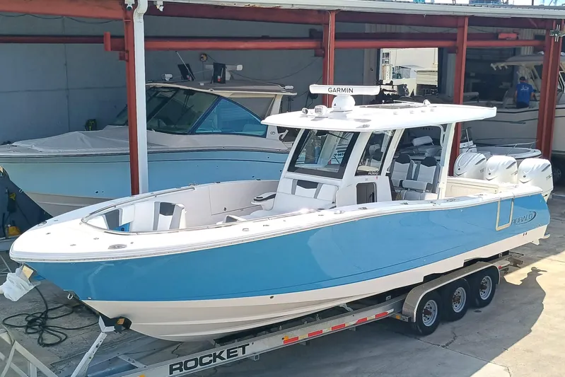 360-105 Yacht Photos Pics 2026 Robalo R360 Center Console boat on trailer in marina setting.
