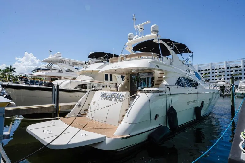 Voluptas Yacht Photos Pics Luxury 2006 Aicon Flybridge yacht docked at marina under clear blue sky.