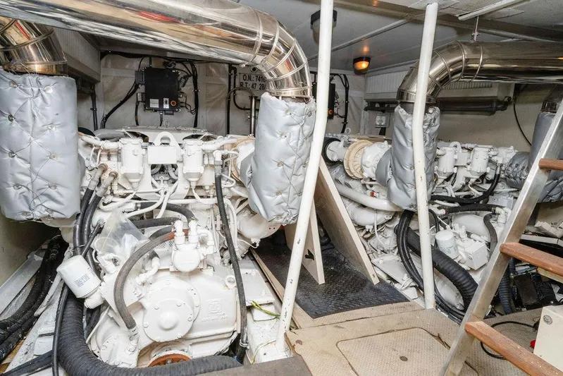 Voluptas Yacht Photos Pics Engine room of 2006 Aicon Flybridge yacht, featuring dual engines and exhaust systems.