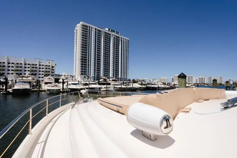 Voluptas Yacht Photos Pics Luxury Aicon Flybridge yacht docked in marina with city skyline, 2006 model.