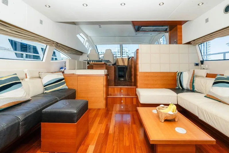 Voluptas Yacht Photos Pics Luxurious interior of 2006 Aicon Flybridge yacht with elegant seating and wooden flooring.