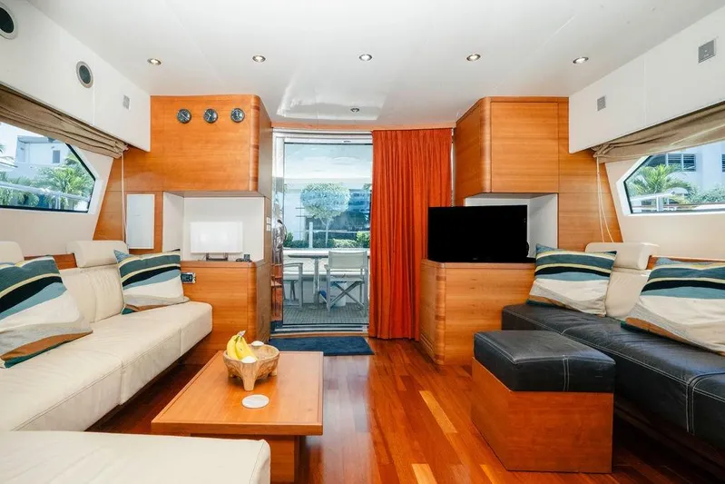 Voluptas Yacht Photos Pics Luxurious interior of 2006 Aicon Flybridge yacht with modern furnishings and wooden accents.