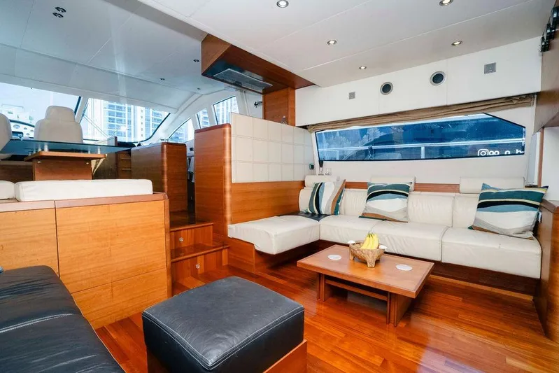 Voluptas Yacht Photos Pics Luxurious interior of 2006 Aicon Flybridge yacht with modern seating and wooden accents.