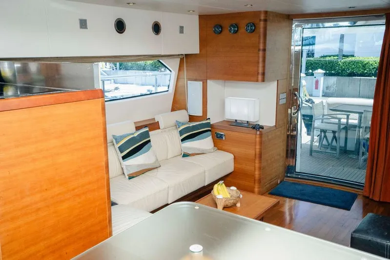 Voluptas Yacht Photos Pics Luxurious interior of a 2006 Aicon Flybridge yacht with modern furnishings and outdoor view.