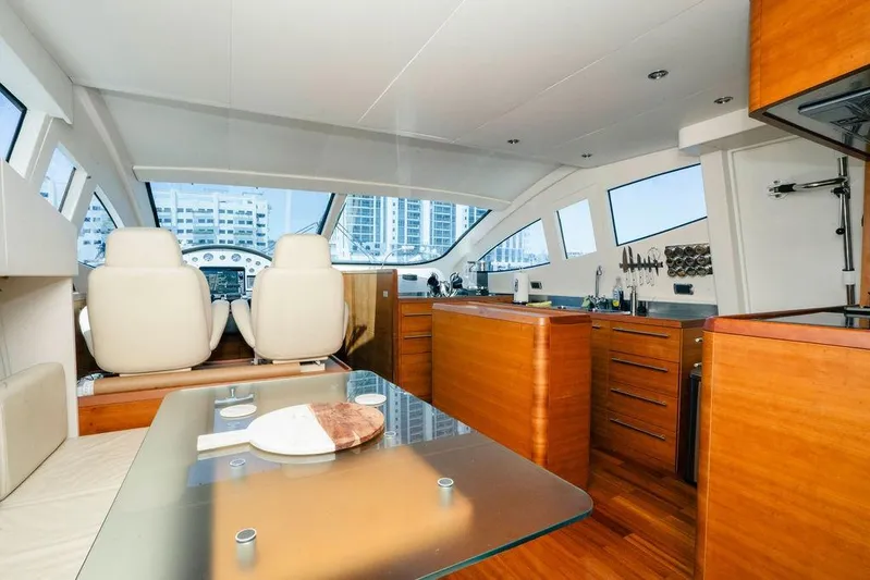 Voluptas Yacht Photos Pics Luxurious interior of 2006 Aicon Flybridge yacht with modern kitchen and seating area.