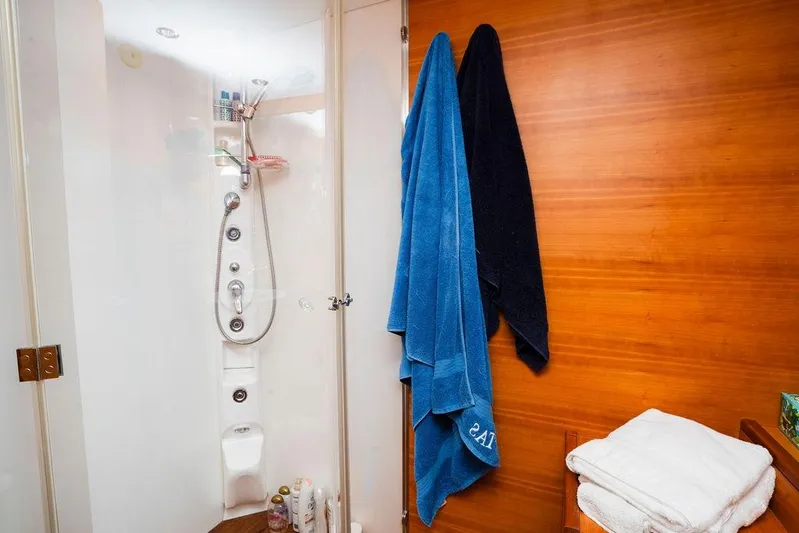 Voluptas Yacht Photos Pics Luxurious bathroom in 2006 Aicon Flybridge yacht with modern shower and towels.