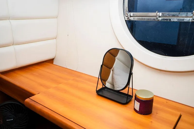 Voluptas Yacht Photos Pics Interior of 2006 Aicon Flybridge yacht with mirror and round window.