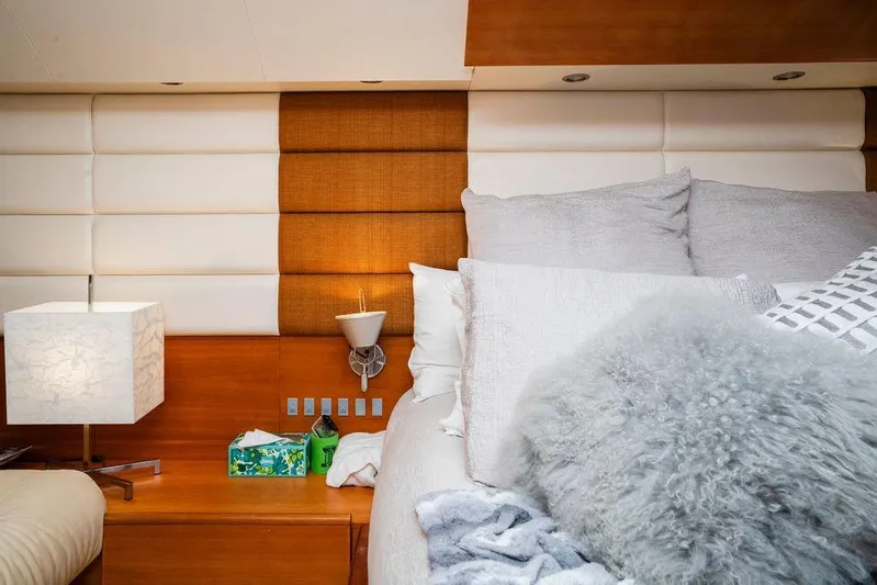 Voluptas Yacht Photos Pics Luxurious bedroom interior on 2006 Aicon Flybridge yacht, featuring plush bedding and modern decor.