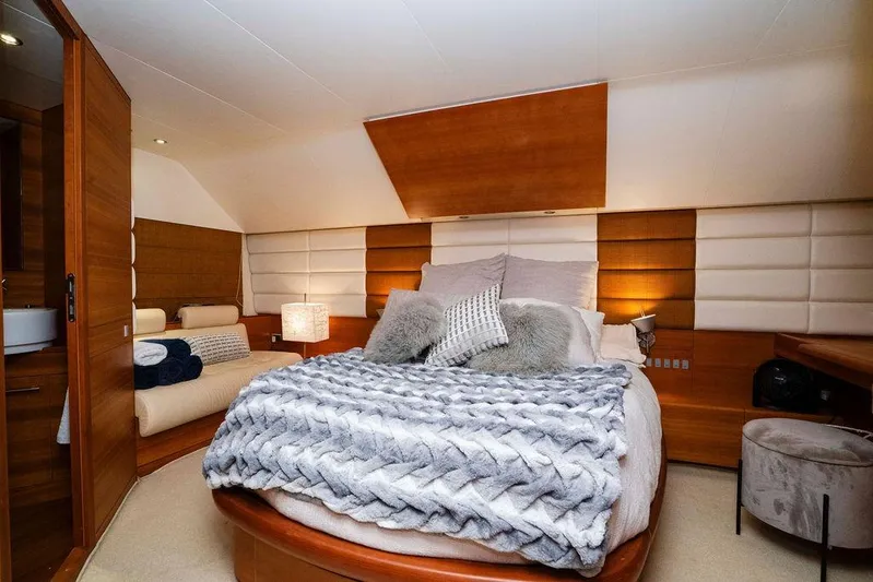 Voluptas Yacht Photos Pics Luxurious bedroom interior on 2006 Aicon Flybridge yacht, featuring cozy bedding and elegant decor.