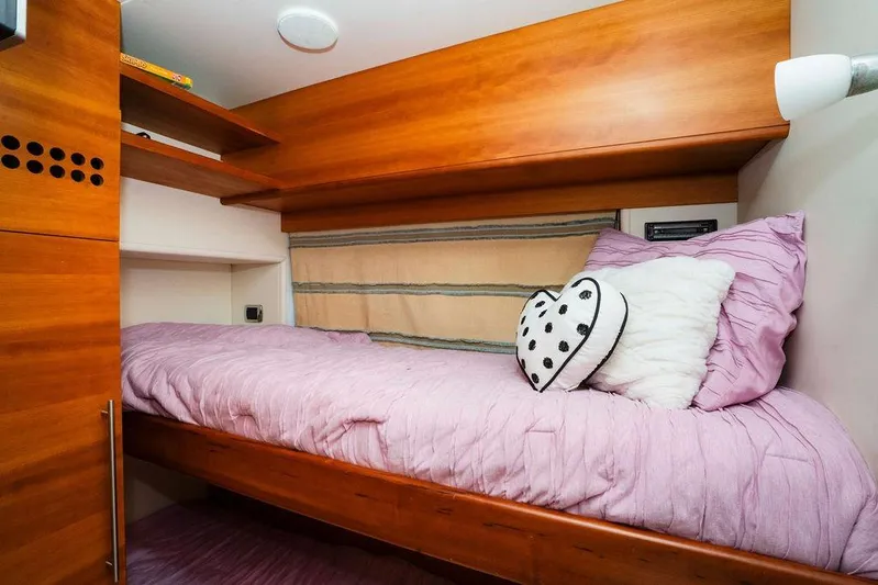 Voluptas Yacht Photos Pics Cozy cabin bed in 2006 Aicon Flybridge yacht with pink bedding and heart pillow.