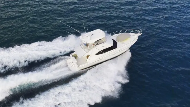  Yacht Photos Pics 2012 Riviera Convertible yacht cruising on open water.