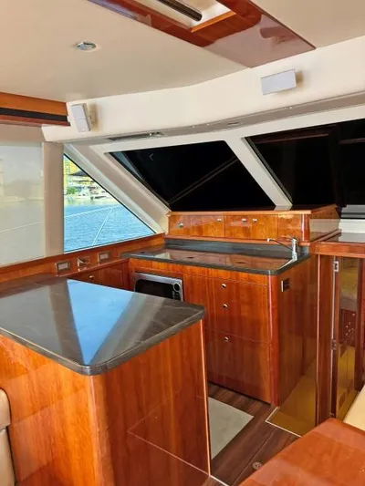  Yacht Photos Pics Luxurious 2012 Riviera Convertible yacht interior with sleek wood finishes and modern amenities.