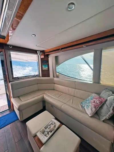  Yacht Photos Pics Luxurious 2012 Riviera Convertible yacht interior with ocean view and plush seating.