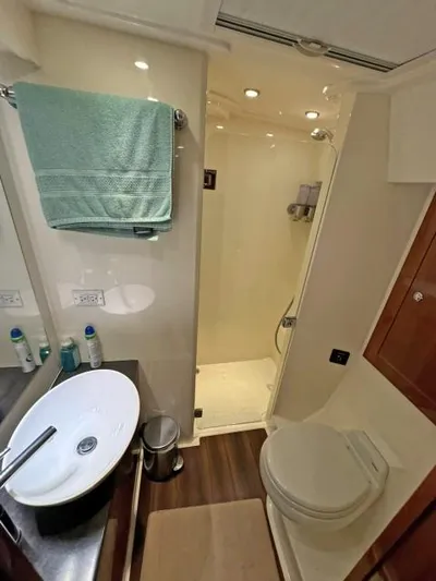  Yacht Photos Pics Luxurious bathroom in 2012 Riviera Convertible yacht with modern fixtures and shower.