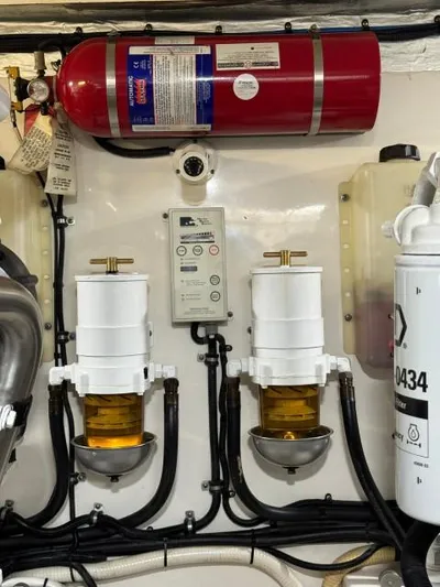  Yacht Photos Pics Engine room of 2012 Riviera Convertible with fire extinguisher and fuel filters.