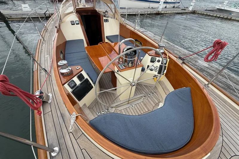 Sea Suite Yacht Photos Pics 2015 Hinckley DS 42 sailboat cockpit with wooden deck and steering wheel.