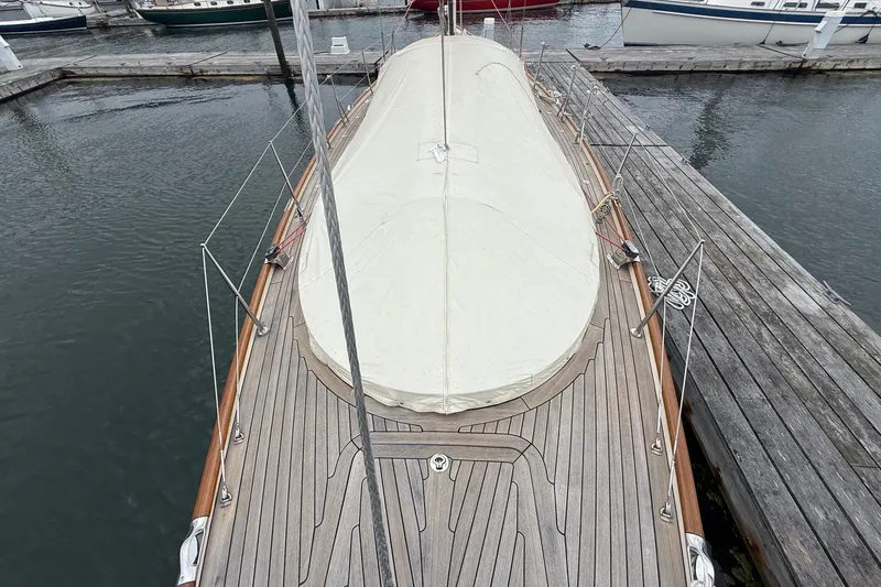 Sea Suite Yacht Photos Pics Hinckley DS 42 sailboat, 2015 model, docked with covered deck and wooden finish.