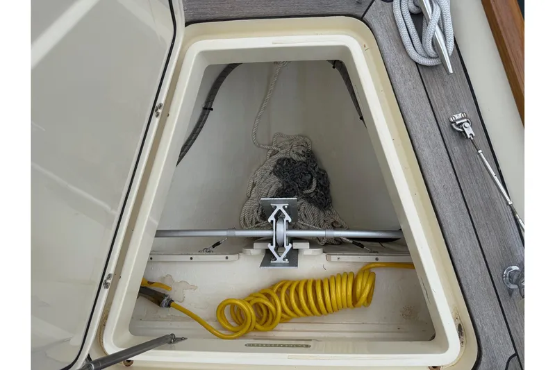 Sea Suite Yacht Photos Pics Hinckley DS 42 (2015) boat storage compartment with ropes and coiled yellow hose.