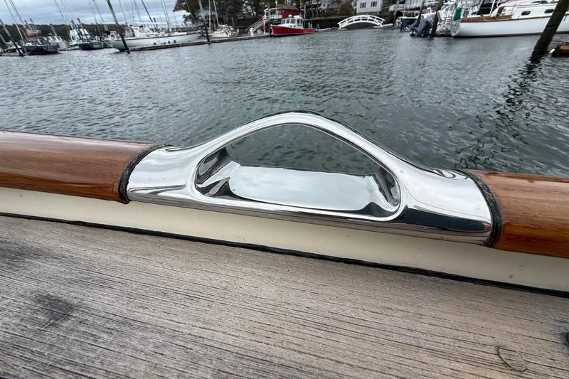 Sea Suite Yacht Photos Pics Polished metal fitting on 2015 Hinckley DS 42 yacht, docked in a marina.