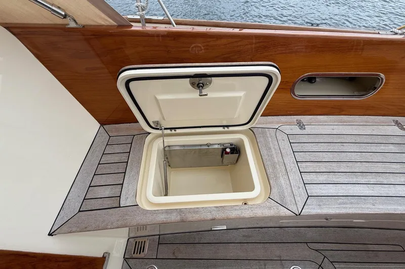 Sea Suite Yacht Photos Pics Open storage compartment on 2015 Hinckley DS 42 yacht deck, featuring wood and metal finishes.