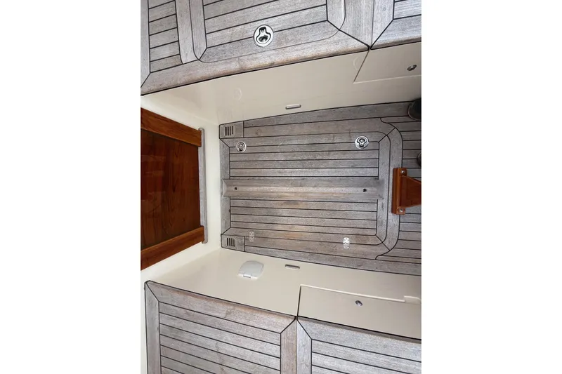 Sea Suite Yacht Photos Pics Hinckley DS 42 (2015) boat deck with wooden finish and sleek design.