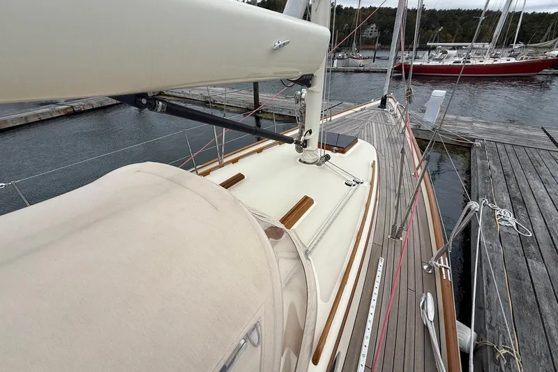 Sea Suite Yacht Photos Pics Hinckley DS 42 sailboat, 2015 model, docked at a marina with wooden deck details.