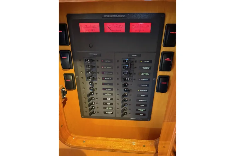 Sea Suite Yacht Photos Pics Electrical control panel on a 2015 Hinckley DS 42 boat, featuring switches and gauges.