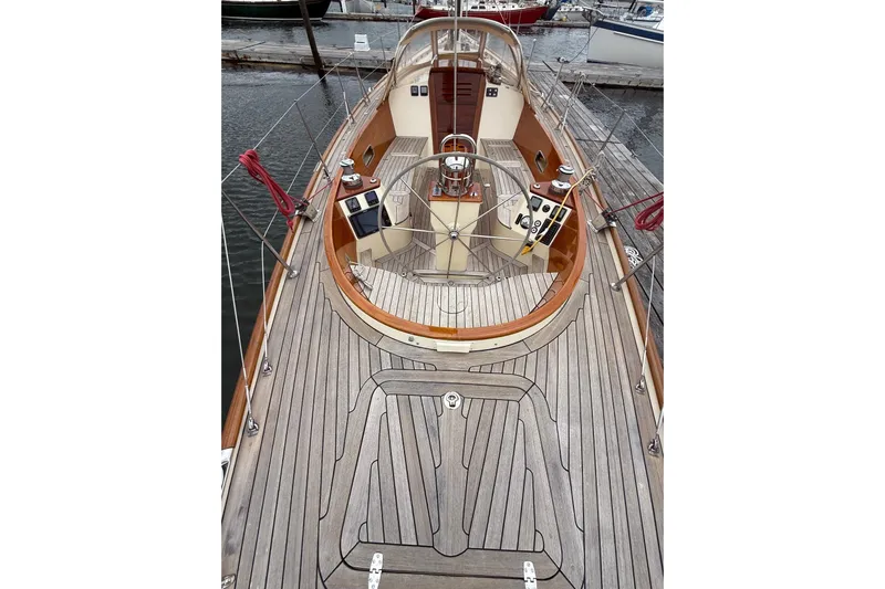 Sea Suite Yacht Photos Pics 2015 Hinckley DS 42 sailboat deck with wooden finish and steering wheel.