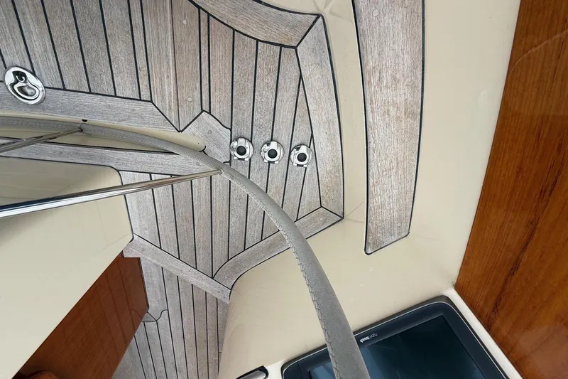 Sea Suite Yacht Photos Pics Interior view of 2015 Hinckley DS 42 yacht with wood paneling and metal fixtures.