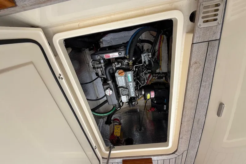 Sea Suite Yacht Photos Pics Engine compartment of a 2015 Hinckley DS 42 boat, showcasing mechanical components.