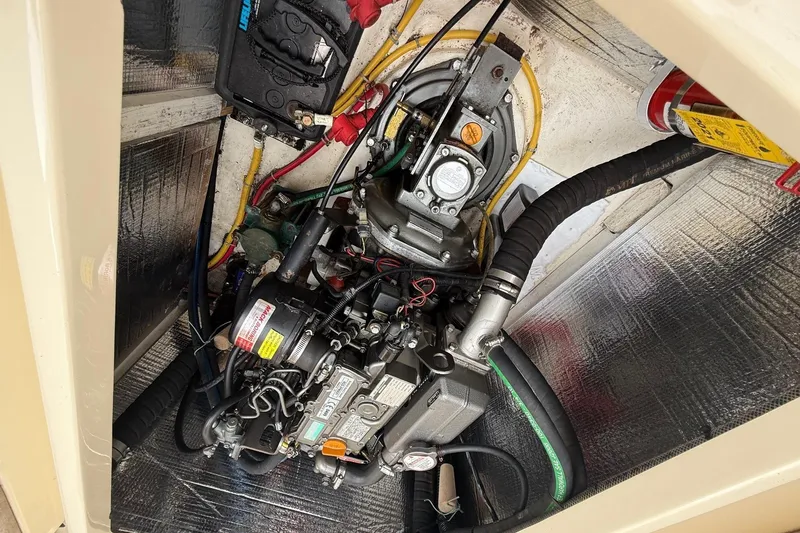 Sea Suite Yacht Photos Pics Engine compartment of a 2015 Hinckley DS 42 boat, showcasing mechanical components.