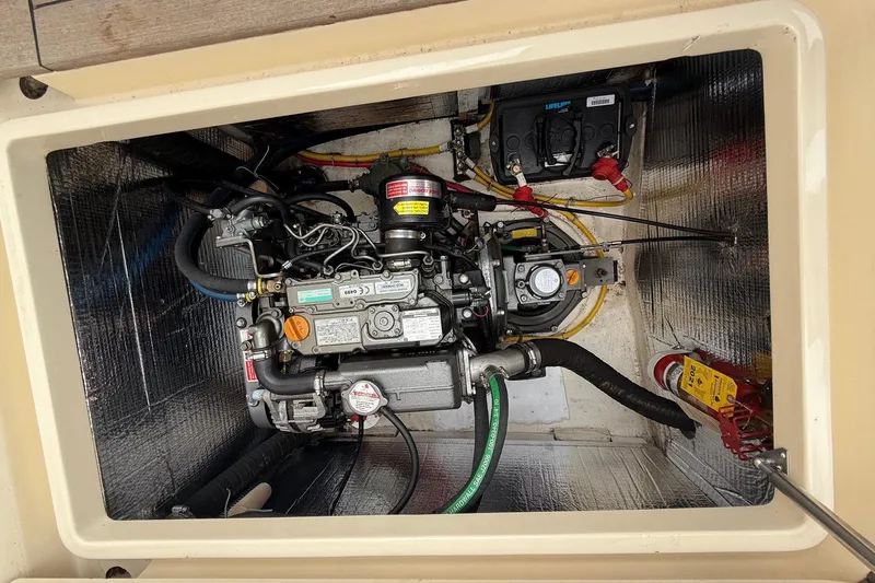 Sea Suite Yacht Photos Pics Engine compartment of a 2015 Hinckley DS 42 boat, showcasing detailed mechanical components.