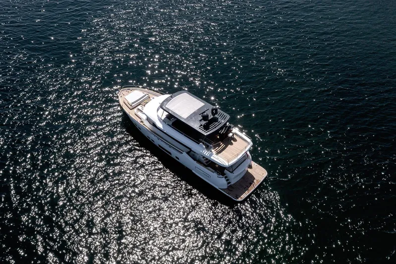  Yacht Photos Pics Aerial view of 2024 Sirena 68 yacht gliding on sparkling water.