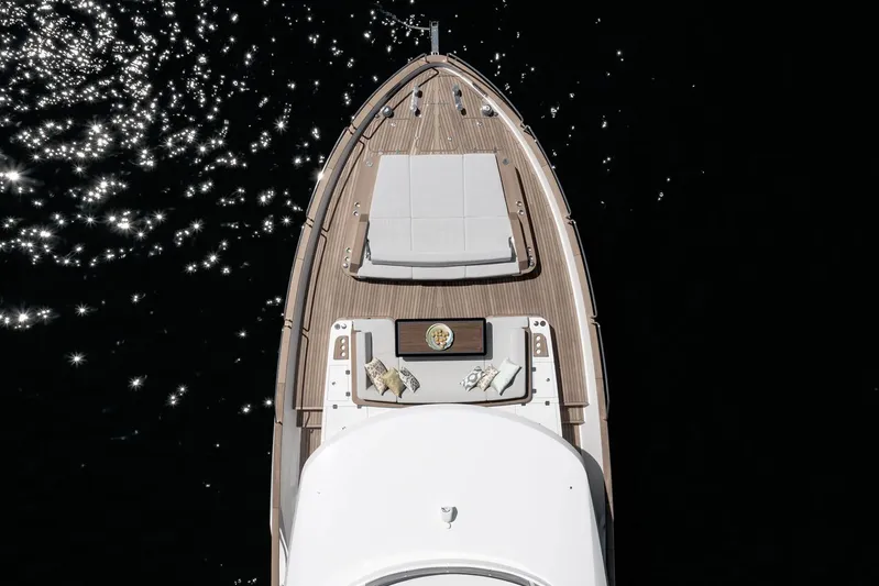  Yacht Photos Pics Aerial view of 2024 Sirena 68 yacht deck with sun loungers and sparkling water.