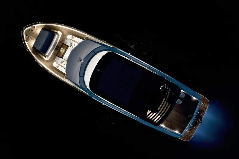  Yacht Photos Pics Aerial view of 2024 Sirena 68 yacht illuminated at night.