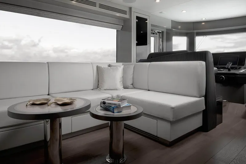  Yacht Photos Pics Luxurious interior of 2024 Sirena 68 yacht with modern seating and tables.