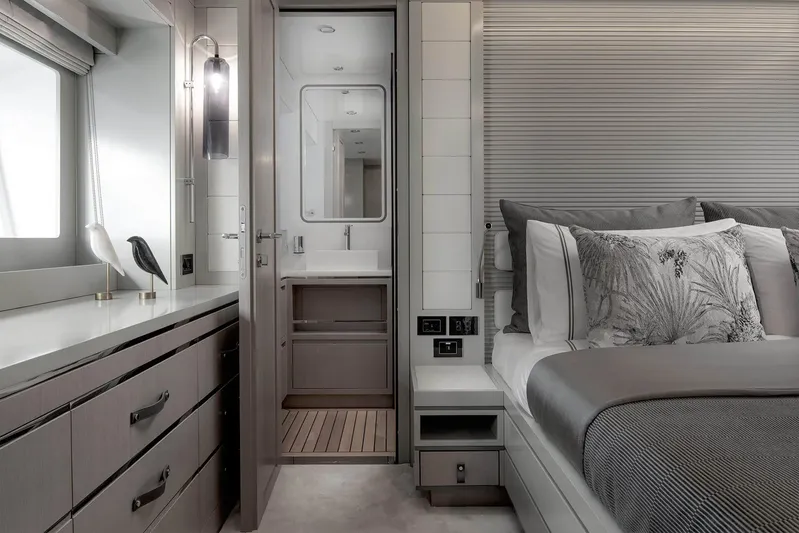  Yacht Photos Pics Luxurious Sirena 68 yacht bedroom interior, featuring elegant decor and modern bathroom, 2024 model.